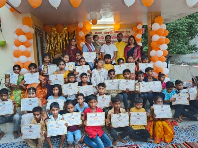 Children holding learning certificates